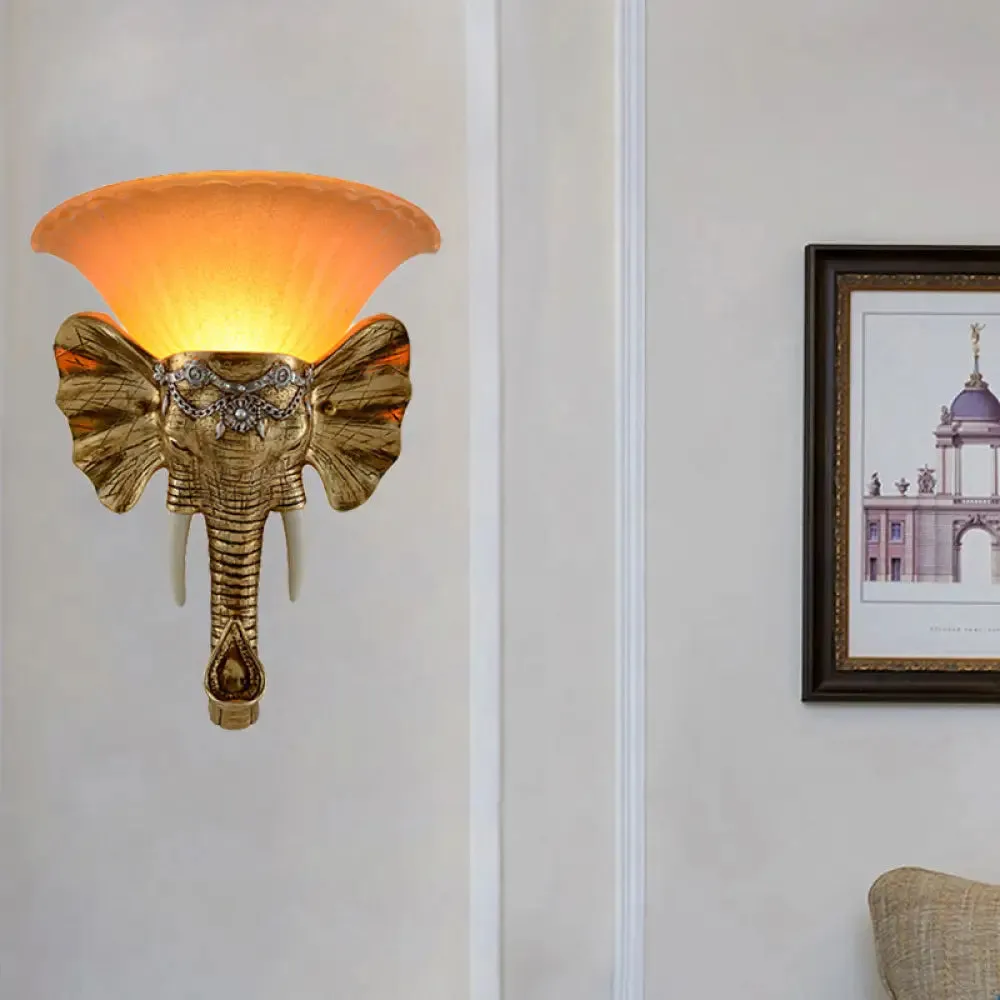 Modern Amber Glass Sconce with Gold Elephant Accent